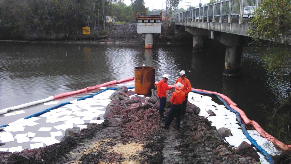 spill scene spill contained using absorbent pads and marine booms
