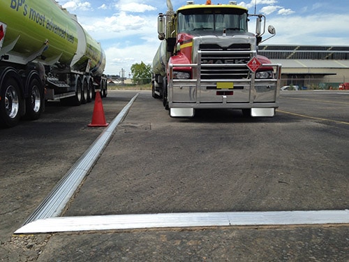 Chatoyer Aluminium Floor Bunding installed in a transport truck parking lot